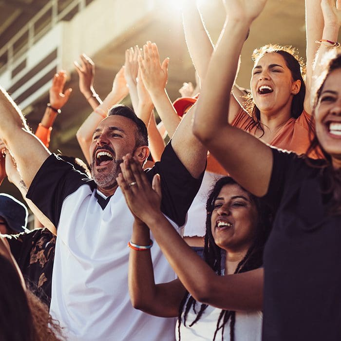 Fans cheering at a DockHounds game in Wisconsin Brewing Company Park