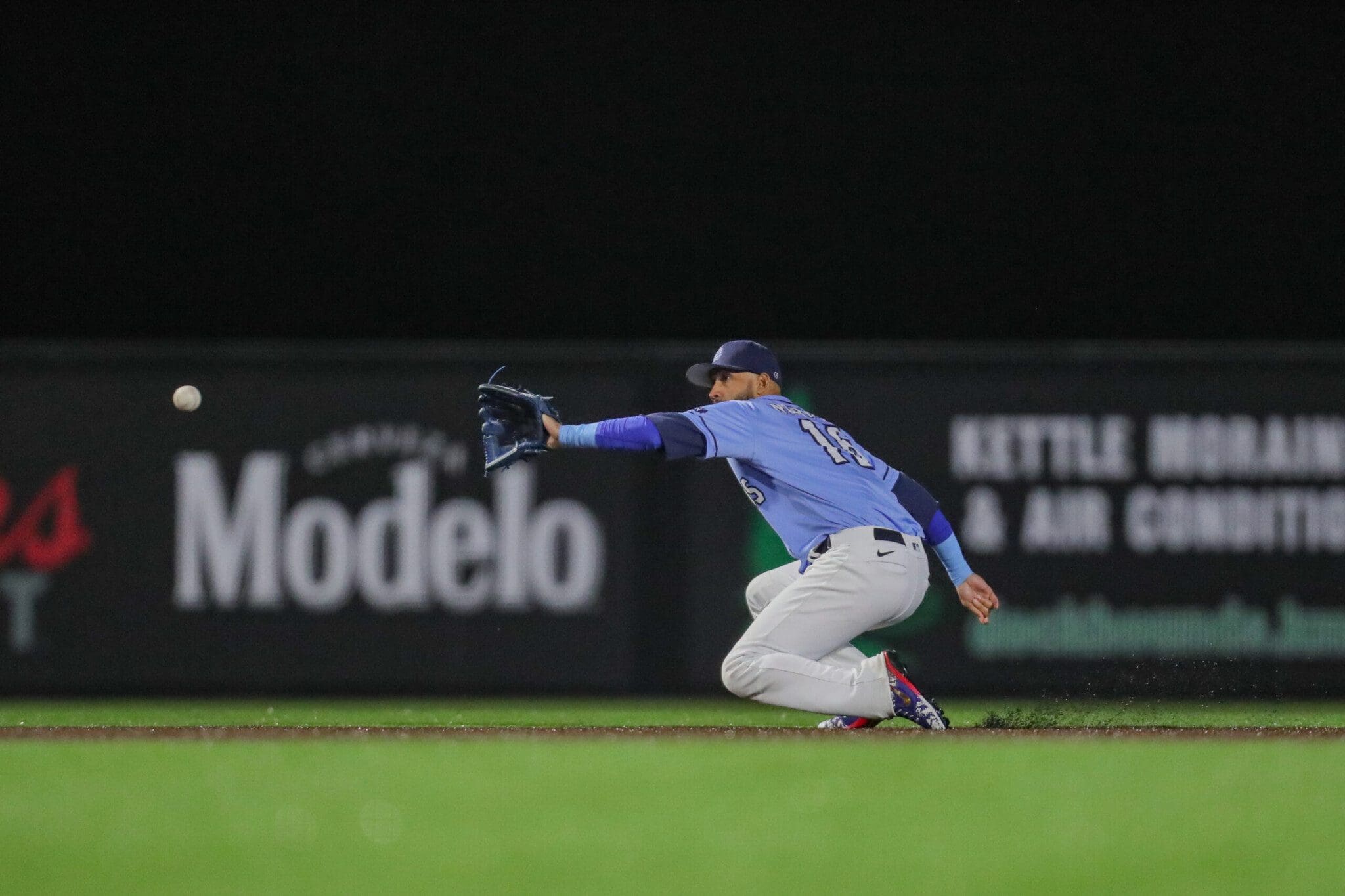 Shortstop fields a ground ball