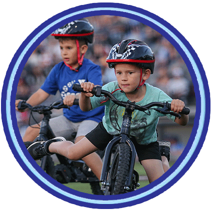 Fans riding on bikes during in-game festivities.