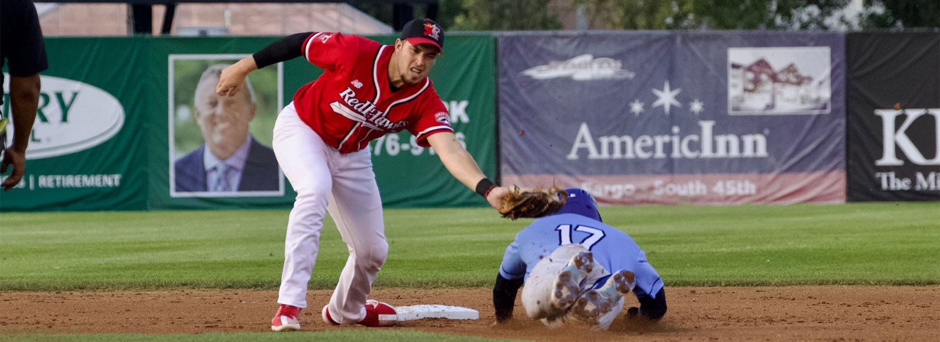 Thomas Jones slides under the attempted tag of the Fargo Shortstop