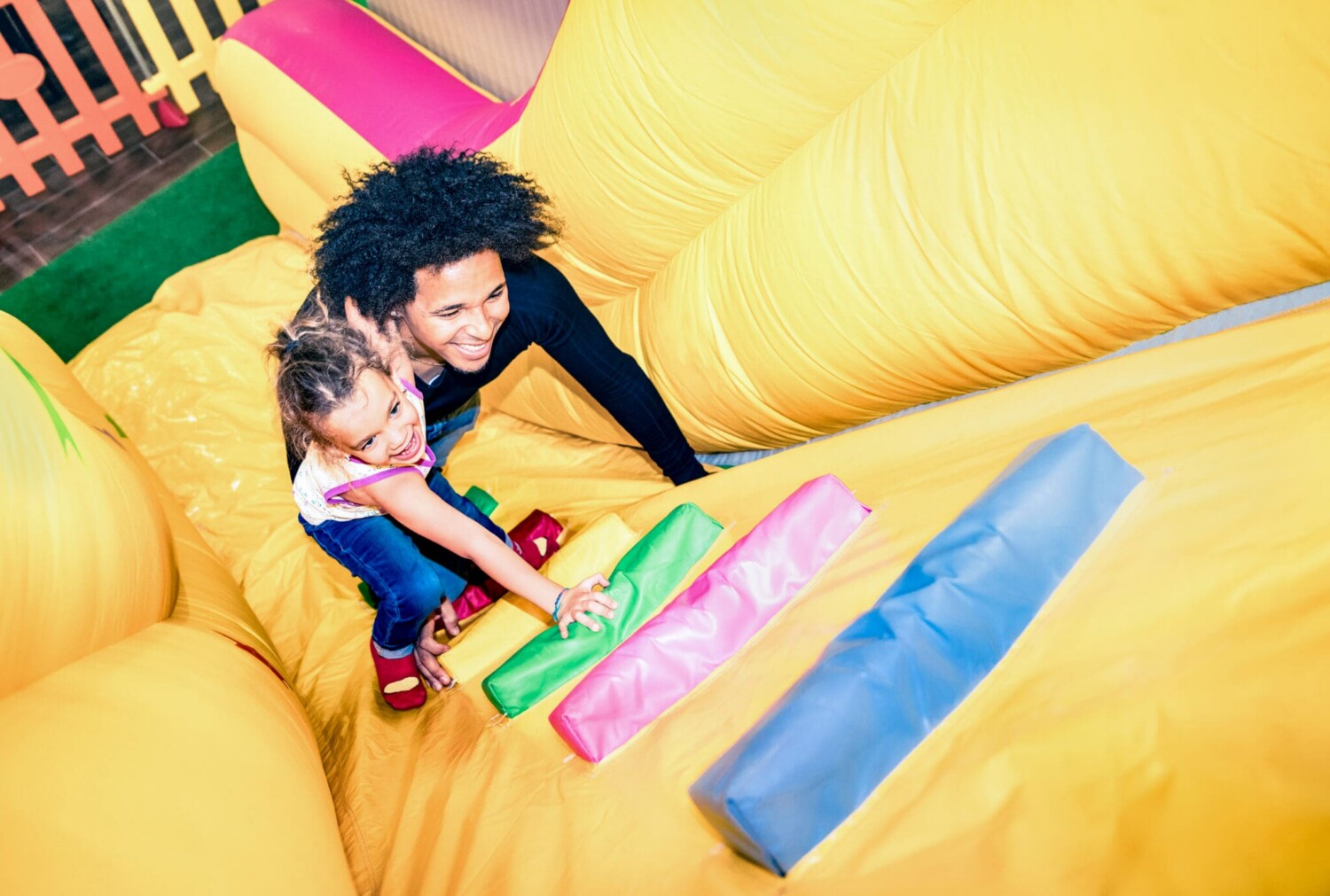 Family playing on bounce house